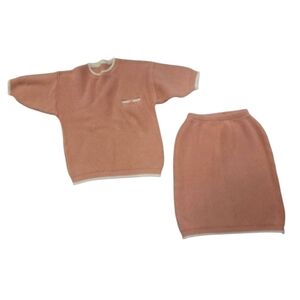 knitted top and skirt, size small. Pink/peach color